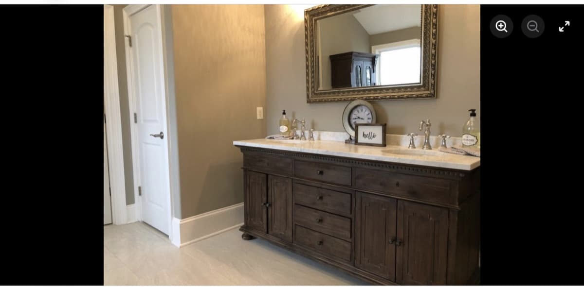 Bathroom remodel with dark wood double-sink vanity