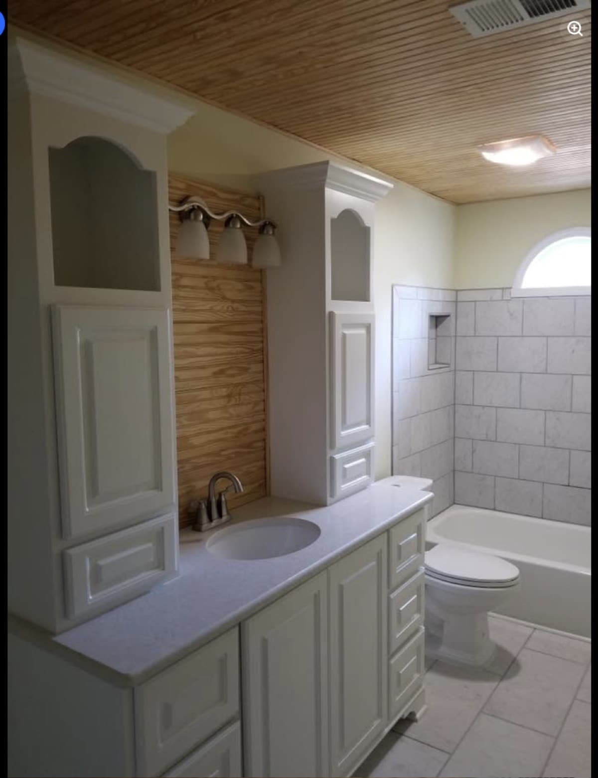 Full bathroom remodel with shiplap accent wall and tile shower