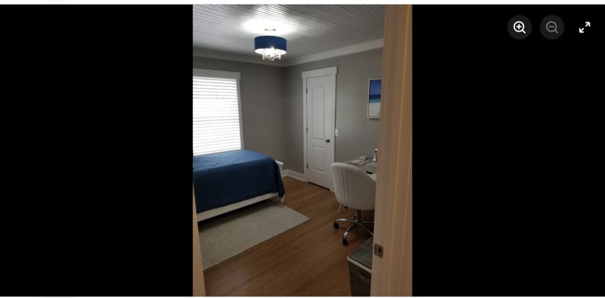 Bedroom renovation with new flooring and fresh paint