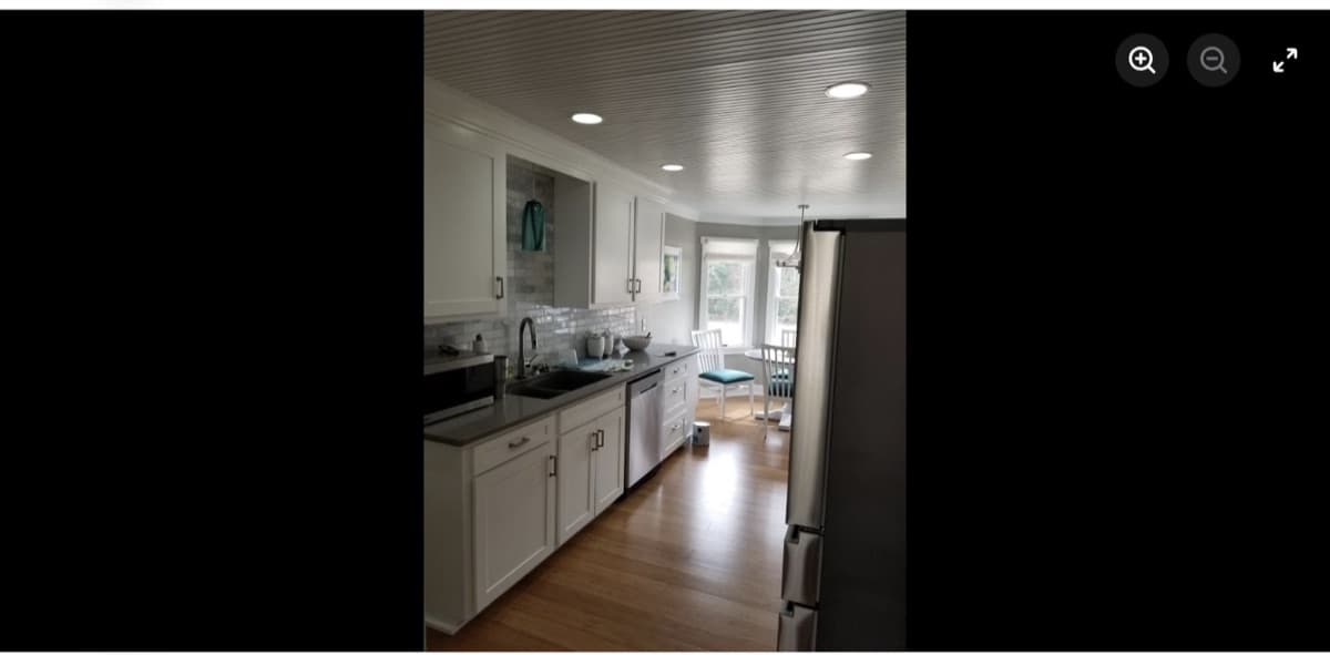 Kitchen remodel with white cabinets, subway tile, and stainless appliances