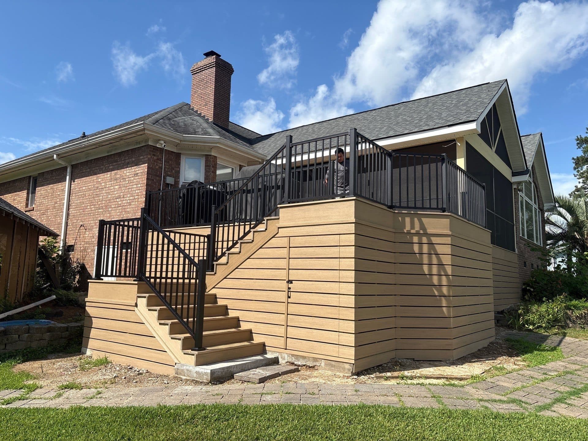 New elevated deck and screened porch on a brick home