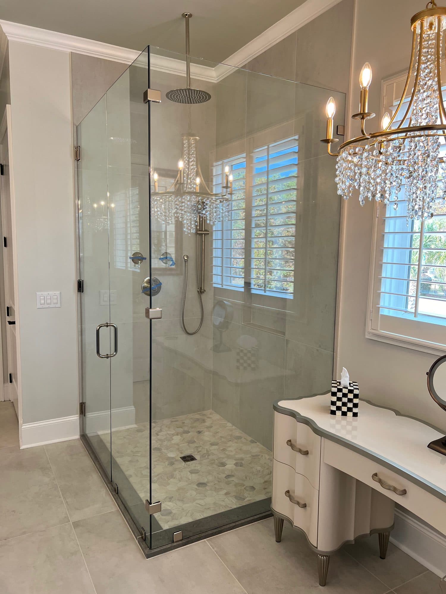 Frameless glass shower installation in renovated bathroom