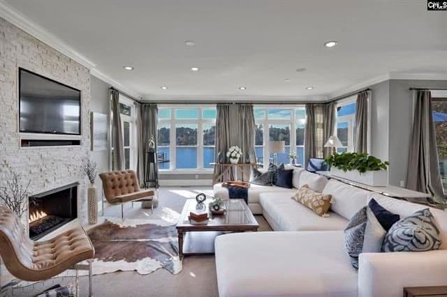 Bright renovated living room with fireplace and built-in seating