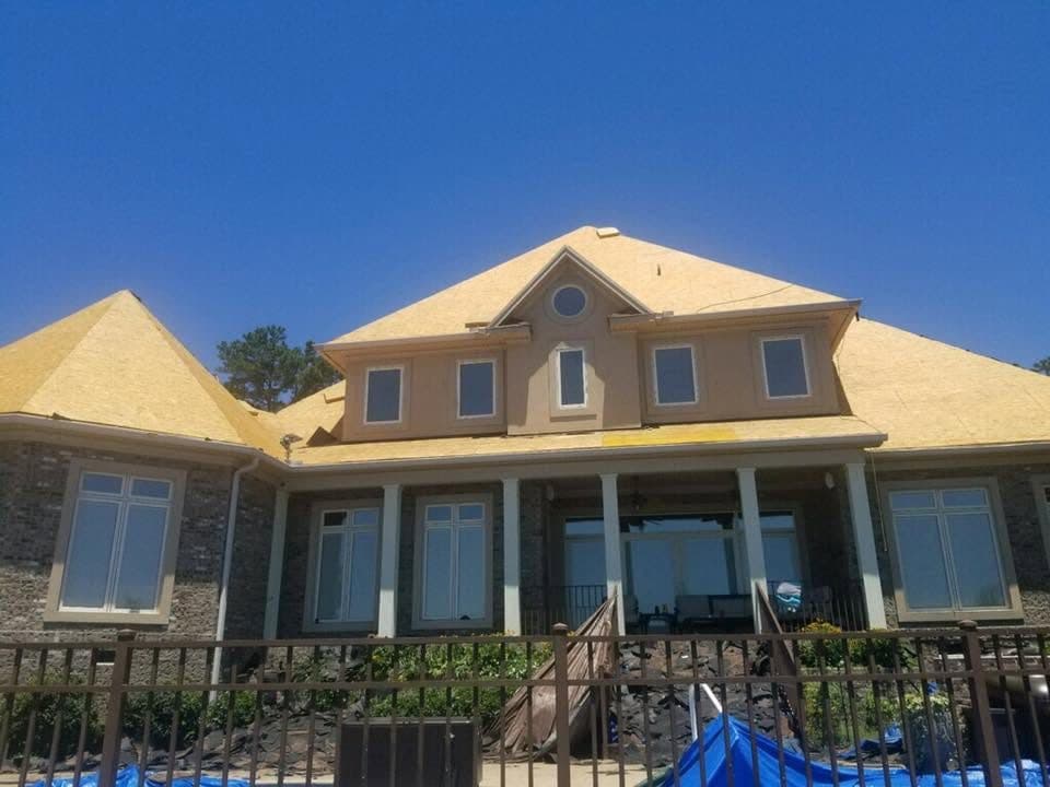 Shingle Roofing in progress for two story house