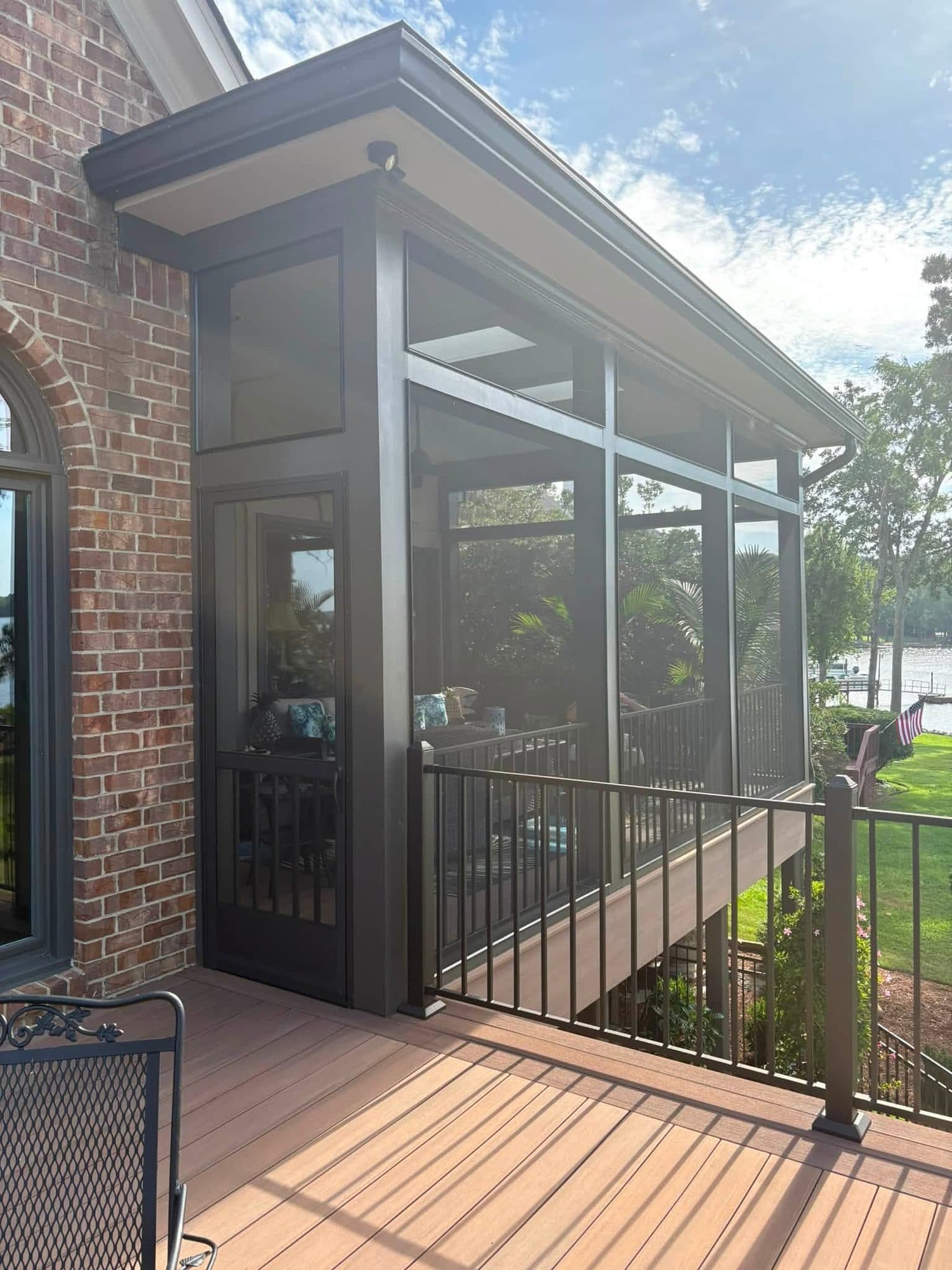 Black Screened Porch with brown deck