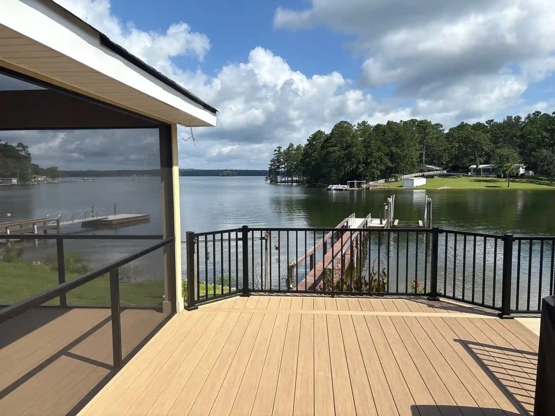 Screened porch and composite wood deck with black railing on Lake Murray, SC