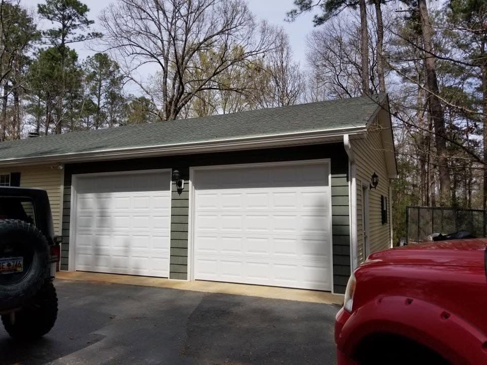 Custom Detached Two Car Garage with two white garage doors